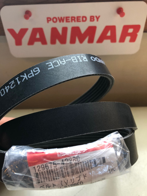 Genuine Yanmar 129675-42280 V-ribbed drive belt with its parts label, marked Mitsuboshi RIB-ACE